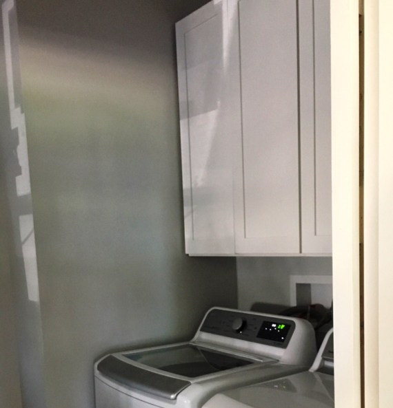 white cabinets in laundry room